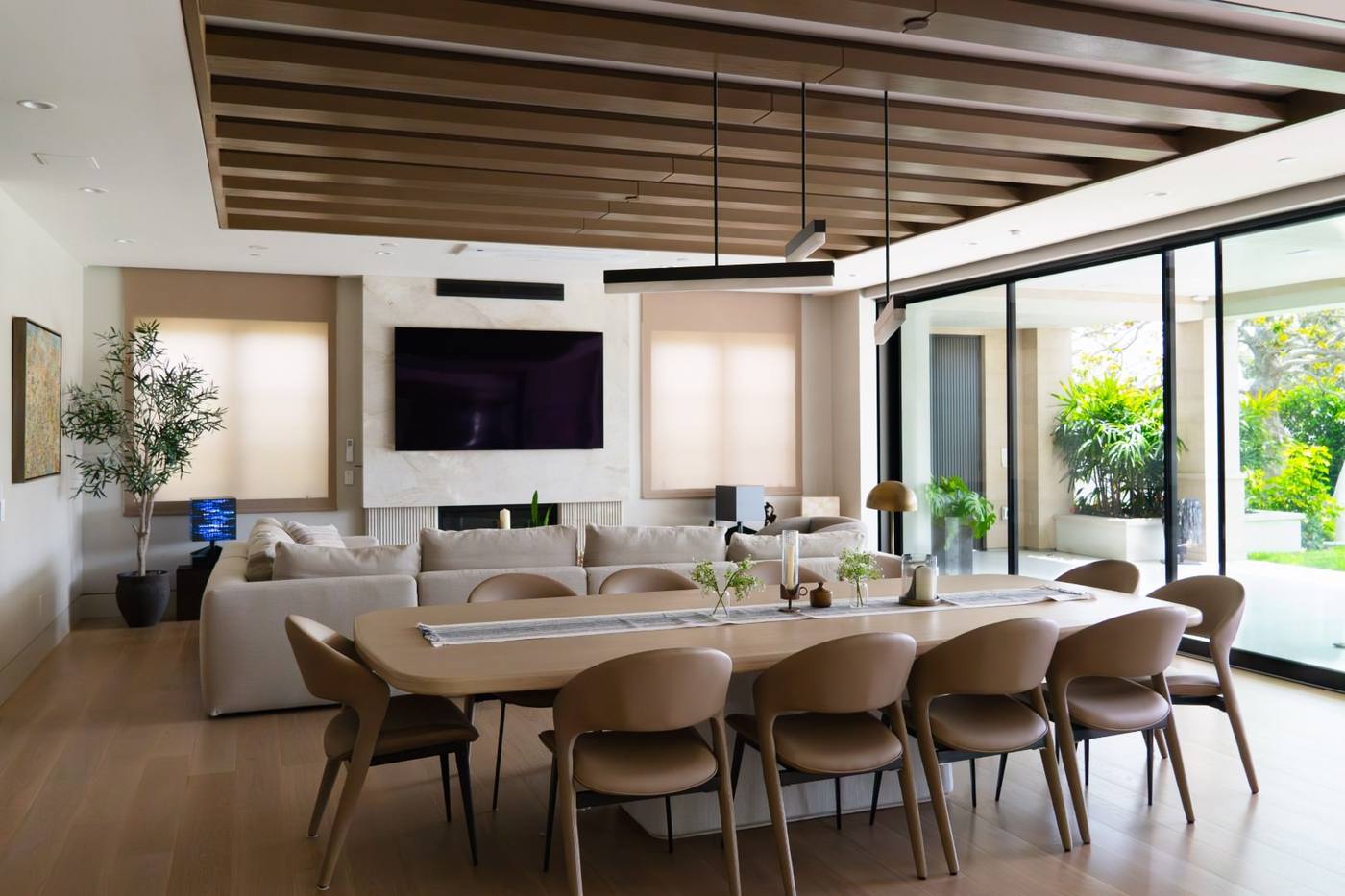 Dining room with long table and wall of glass