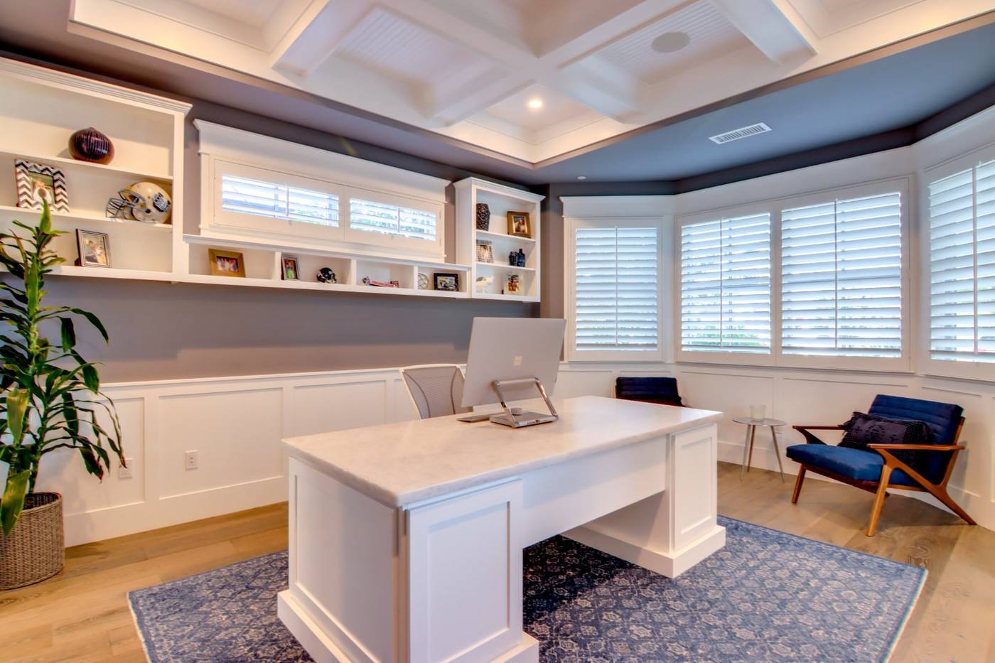 Study with built in cabinetry and window seat