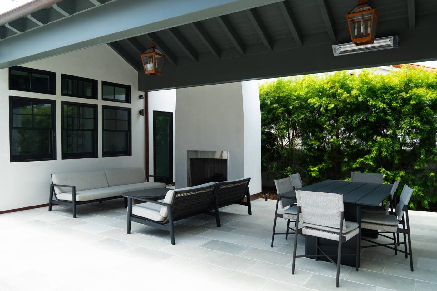 Covered patio with fireplace and dining