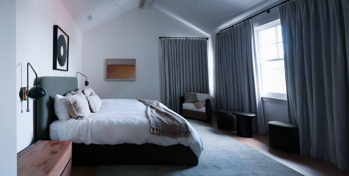 Primary bedroom with vaulted ceiling