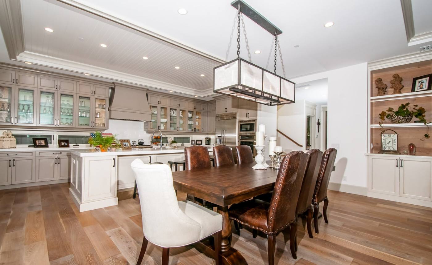 Dining room with long table open to the kitchen