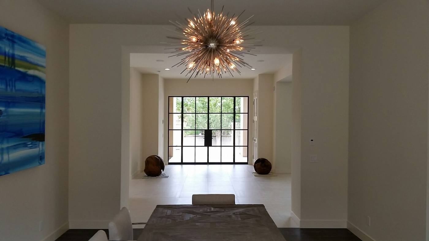 Entry hall with sculptural sputnik chandelier