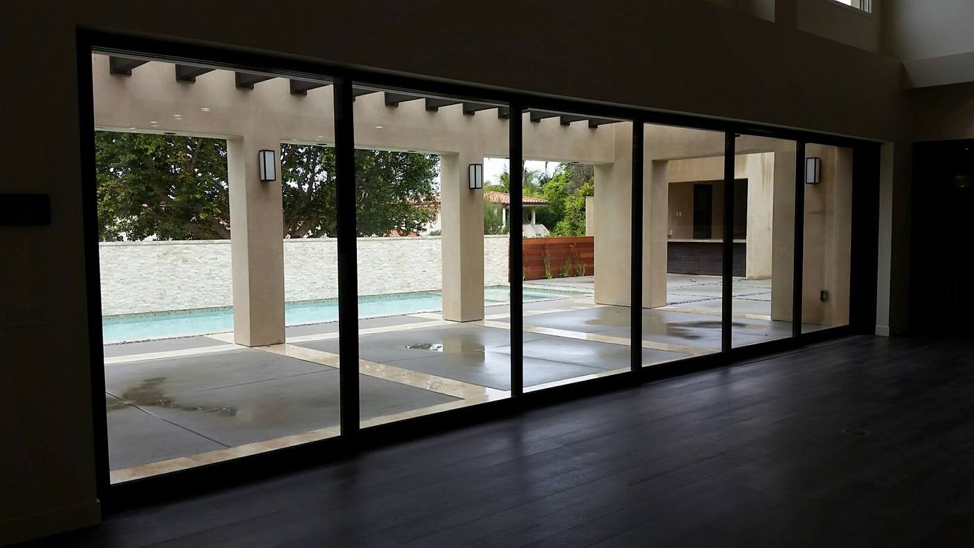 Wall of glass doors opening to the courtyard