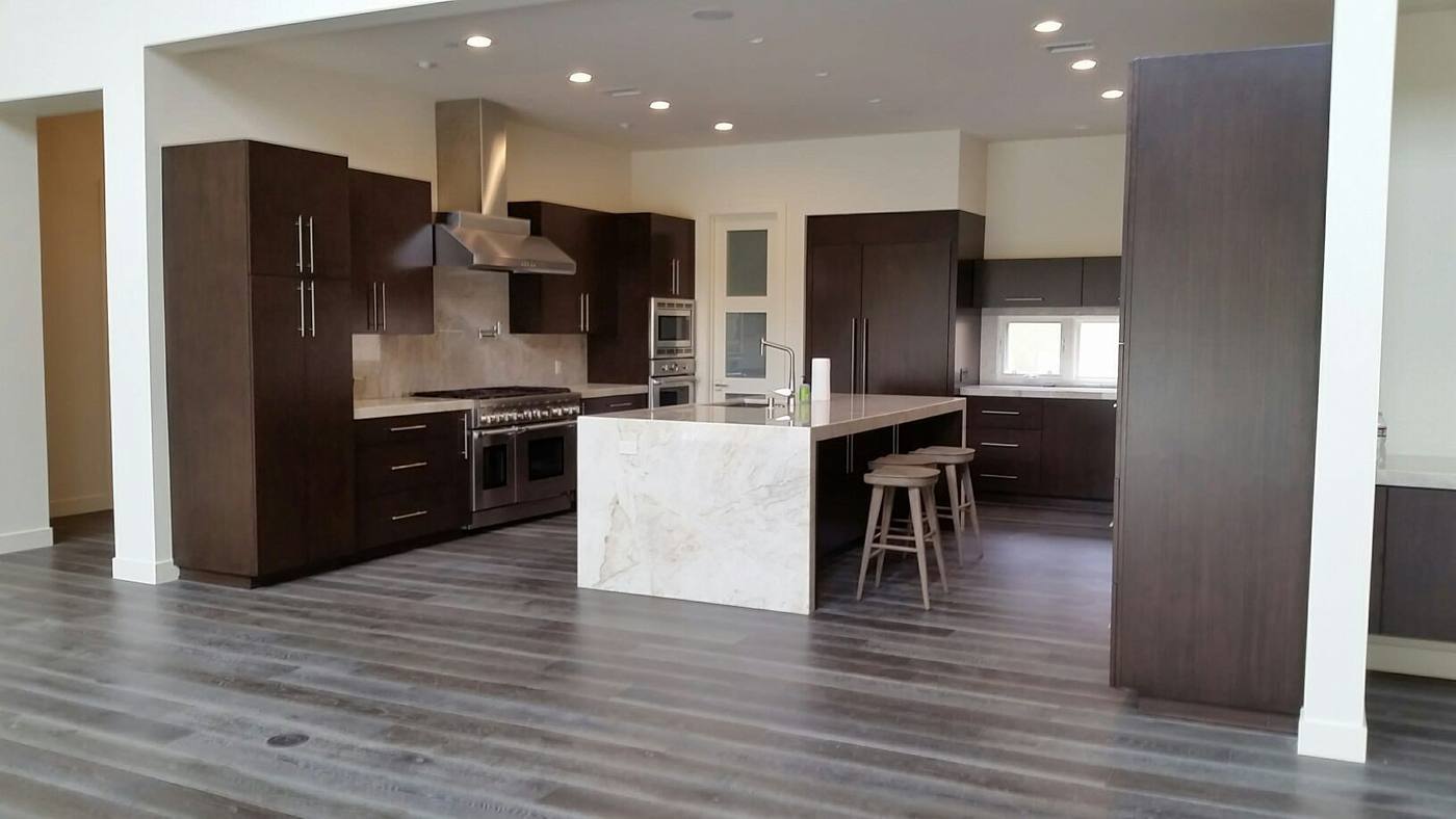 Kitchen with island and dark cabinetry