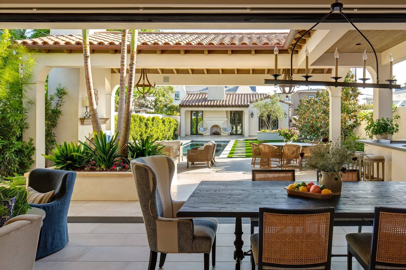 Outdoor dining table under a timber loggia