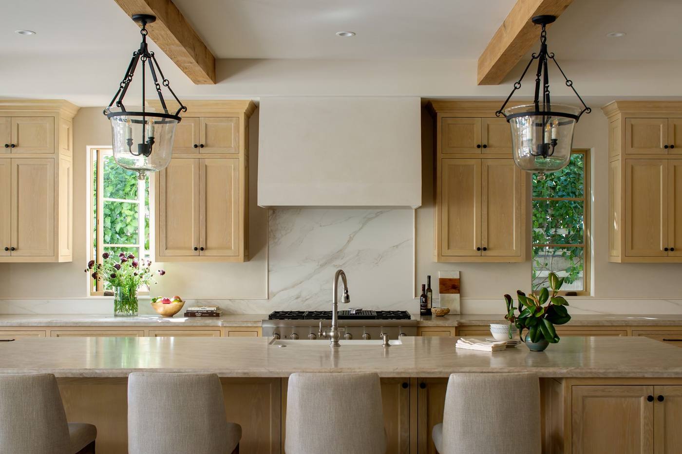 Kitchen with lantern pendants and stone counters