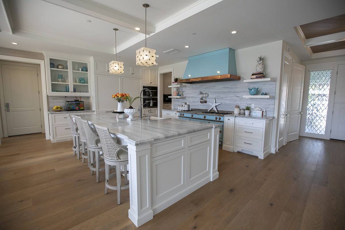 Kitchen with marble island and pendant lighting